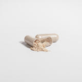 Lion's Mane Hericium erinaceus capsules and mushroom powder close-up